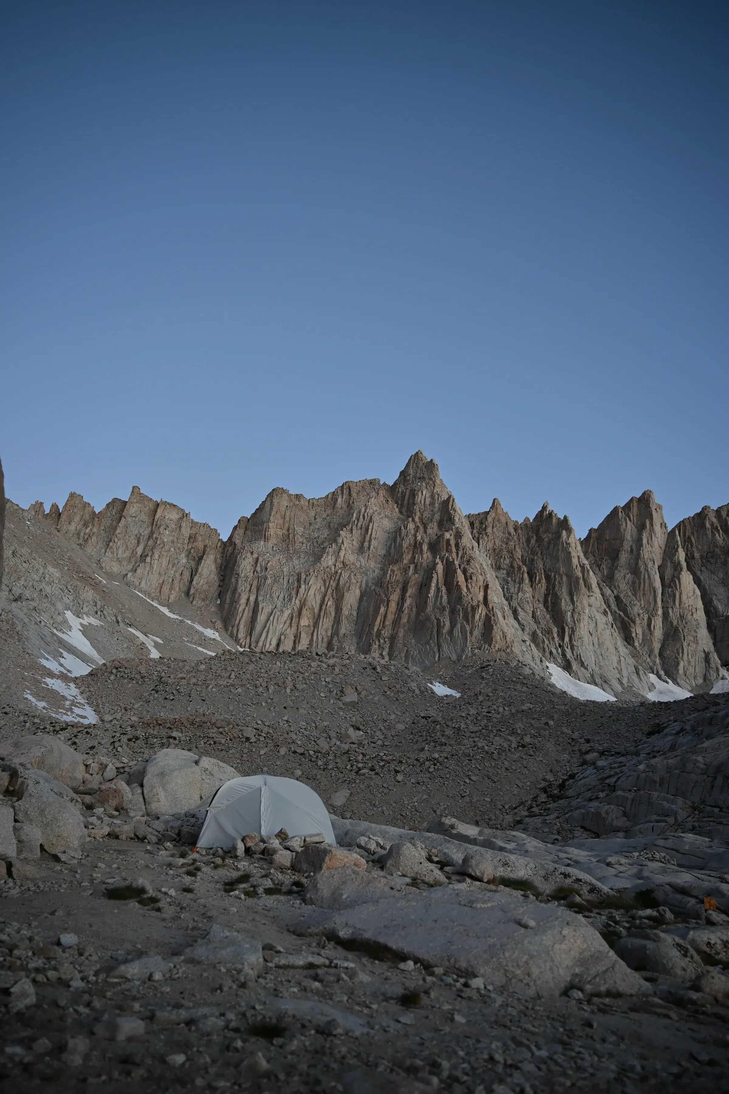 A granite cliff edge against open sky